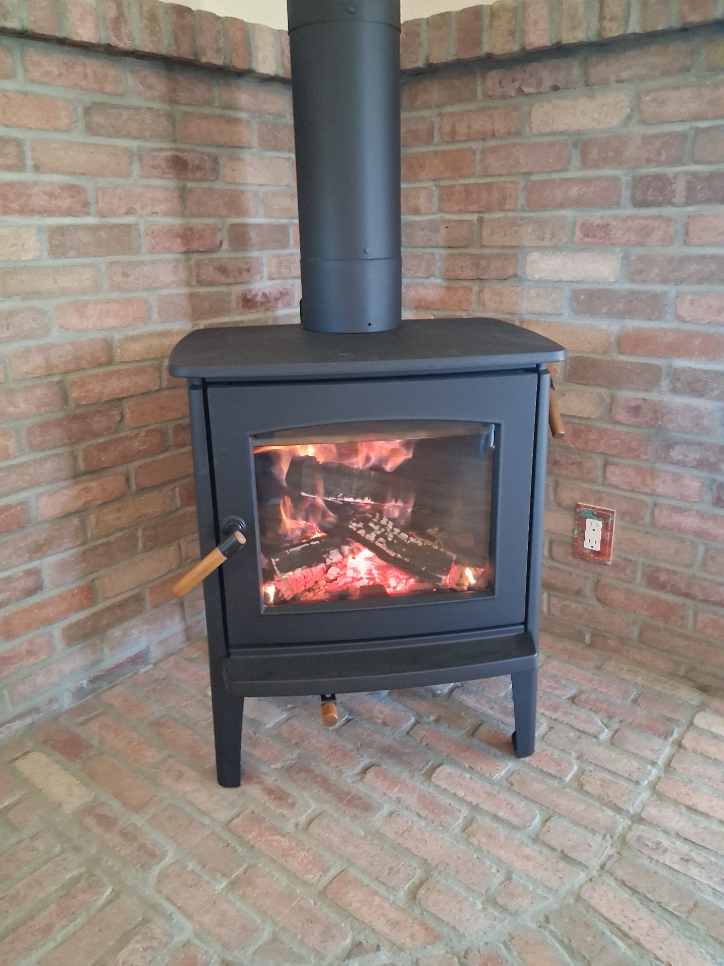 Ambiance Hipster wood stove installed in brick hearth in Prescott AZ